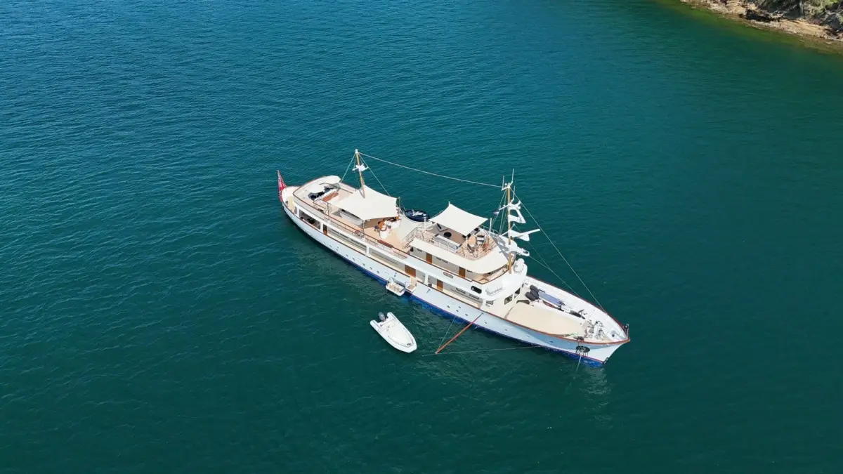 Aerial view of the classic motor yacht Istros at anchor, her teak upper decks set with exterior furniture by Marxcraft